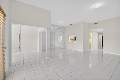 Nestled within a gated community, this 3 bedroom 2.5 bath on Boca Delray Golf and Country Club in Florida - for sale on GolfHomes.com, golf home, golf lot