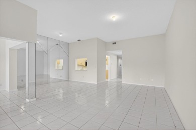 Nestled within a gated community, this 3 bedroom 2.5 bath on Boca Delray Golf and Country Club in Florida - for sale on GolfHomes.com, golf home, golf lot