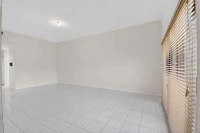 Nestled within a gated community, this 3 bedroom 2.5 bath on Boca Delray Golf and Country Club in Florida - for sale on GolfHomes.com, golf home, golf lot