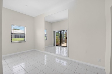 Nestled within a gated community, this 3 bedroom 2.5 bath on Boca Delray Golf and Country Club in Florida - for sale on GolfHomes.com, golf home, golf lot