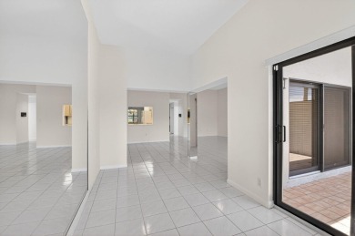 Nestled within a gated community, this 3 bedroom 2.5 bath on Boca Delray Golf and Country Club in Florida - for sale on GolfHomes.com, golf home, golf lot