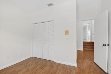 Nestled within a gated community, this 3 bedroom 2.5 bath on Boca Delray Golf and Country Club in Florida - for sale on GolfHomes.com, golf home, golf lot