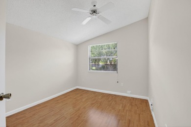 Nestled within a gated community, this 3 bedroom 2.5 bath on Boca Delray Golf and Country Club in Florida - for sale on GolfHomes.com, golf home, golf lot