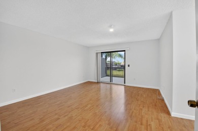 Nestled within a gated community, this 3 bedroom 2.5 bath on Boca Delray Golf and Country Club in Florida - for sale on GolfHomes.com, golf home, golf lot