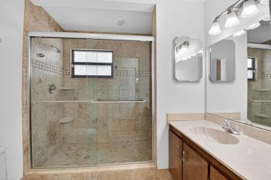 Nestled within a gated community, this 3 bedroom 2.5 bath on Boca Delray Golf and Country Club in Florida - for sale on GolfHomes.com, golf home, golf lot