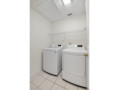 Nestled within a gated community, this 3 bedroom 2.5 bath on Boca Delray Golf and Country Club in Florida - for sale on GolfHomes.com, golf home, golf lot