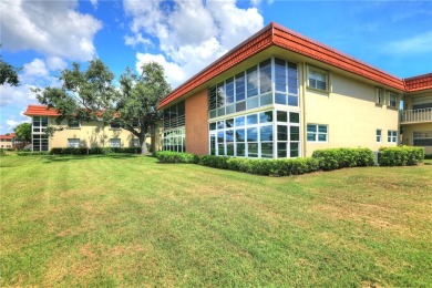 Adorable, updated 2BR/2BA first-floor unit in Vista Royale, a on The American Golf Club in Florida - for sale on GolfHomes.com, golf home, golf lot
