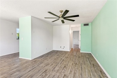 Retirement just got an upgrade! Enjoy carefree living in this on The American Golf Club in Florida - for sale on GolfHomes.com, golf home, golf lot