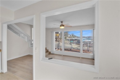 Discover this waterfront retreat with easy walkout to shoreline on Seasons Ridge At Four Seasons in Missouri - for sale on GolfHomes.com, golf home, golf lot