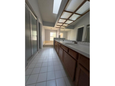 Light and bright 3BED/2BA Condominium with attached garage on East Lake Woodlands Country Club in Florida - for sale on GolfHomes.com, golf home, golf lot