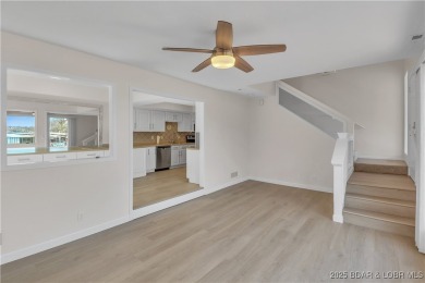 Discover this waterfront retreat with easy walkout to shoreline on Seasons Ridge At Four Seasons in Missouri - for sale on GolfHomes.com, golf home, golf lot