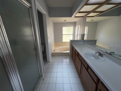 Light and bright 3BED/2BA Condominium with attached garage on East Lake Woodlands Country Club in Florida - for sale on GolfHomes.com, golf home, golf lot