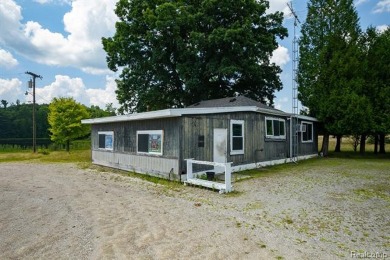 123+ Acres with a Lake, 2 Pole Barns, a Club House & a 2 Bed/2 on Arcadia Hills Golf Course in Michigan - for sale on GolfHomes.com, golf home, golf lot