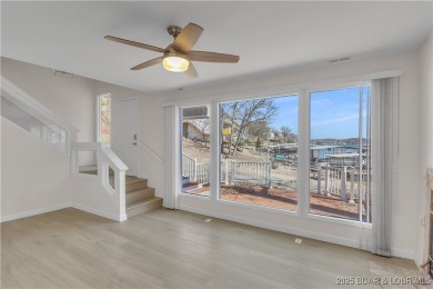 Discover this waterfront retreat with easy walkout to shoreline on Seasons Ridge At Four Seasons in Missouri - for sale on GolfHomes.com, golf home, golf lot