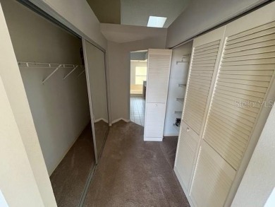 Light and bright 3BED/2BA Condominium with attached garage on East Lake Woodlands Country Club in Florida - for sale on GolfHomes.com, golf home, golf lot