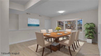 Discover this waterfront retreat with easy walkout to shoreline on Seasons Ridge At Four Seasons in Missouri - for sale on GolfHomes.com, golf home, golf lot