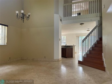 Discover this elegant 2-story residence in the highly on Palm-Aire Country Club and Resort - The Oaks in Florida - for sale on GolfHomes.com, golf home, golf lot