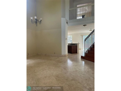 Discover this elegant 2-story residence in the highly on Palm-Aire Country Club and Resort - The Oaks in Florida - for sale on GolfHomes.com, golf home, golf lot