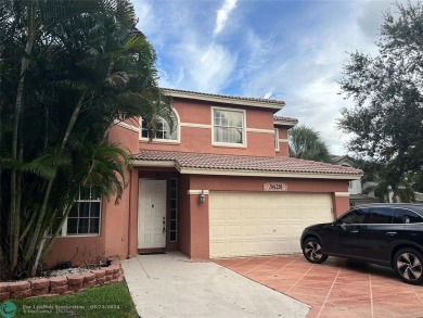 Discover this elegant 2-story residence in the highly on Palm-Aire Country Club and Resort - The Oaks in Florida - for sale on GolfHomes.com, golf home, golf lot