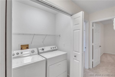 Discover this waterfront retreat with easy walkout to shoreline on Seasons Ridge At Four Seasons in Missouri - for sale on GolfHomes.com, golf home, golf lot