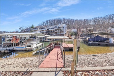 Discover this waterfront retreat with easy walkout to shoreline on Seasons Ridge At Four Seasons in Missouri - for sale on GolfHomes.com, golf home, golf lot