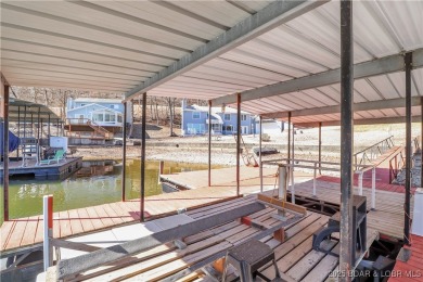 Discover this waterfront retreat with easy walkout to shoreline on Seasons Ridge At Four Seasons in Missouri - for sale on GolfHomes.com, golf home, golf lot