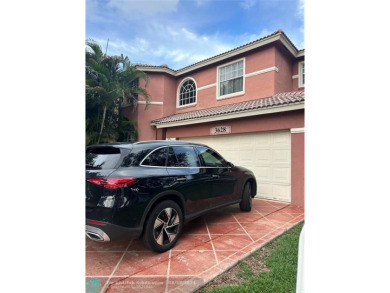 Discover this elegant 2-story residence in the highly on Palm-Aire Country Club and Resort - The Oaks in Florida - for sale on GolfHomes.com, golf home, golf lot