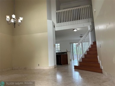 Discover this elegant 2-story residence in the highly on Palm-Aire Country Club and Resort - The Oaks in Florida - for sale on GolfHomes.com, golf home, golf lot