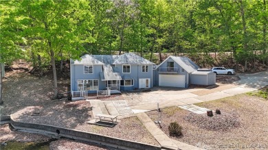 Discover this waterfront retreat with easy walkout to shoreline on Seasons Ridge At Four Seasons in Missouri - for sale on GolfHomes.com, golf home, golf lot