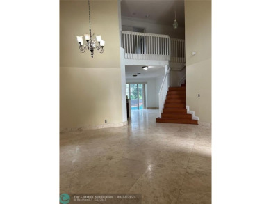 Discover this elegant 2-story residence in the highly on Palm-Aire Country Club and Resort - The Oaks in Florida - for sale on GolfHomes.com, golf home, golf lot