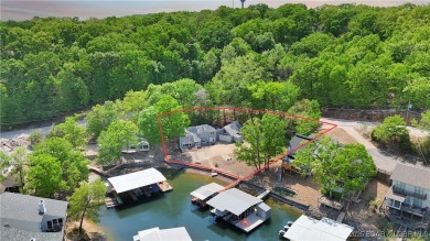 Discover this waterfront retreat with easy walkout to shoreline on Seasons Ridge At Four Seasons in Missouri - for sale on GolfHomes.com, golf home, golf lot