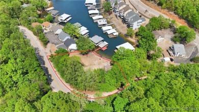 Discover this waterfront retreat with easy walkout to shoreline on Seasons Ridge At Four Seasons in Missouri - for sale on GolfHomes.com, golf home, golf lot