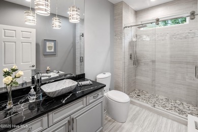 Welcome to 704 Squire Lane, where timeless elegance meets modern on Porters Neck Country Club in North Carolina - for sale on GolfHomes.com, golf home, golf lot