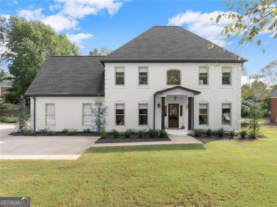 Absolutely stunning two-story home situated on the 6th fairway on Royal Lakes Golf and Country Club in Georgia - for sale on GolfHomes.com, golf home, golf lot