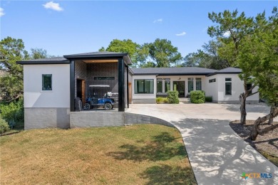 Stunning, modern-contemporary Point Venture home nestled just on Point Venture Golf Club on Lake Travis in Texas - for sale on GolfHomes.com, golf home, golf lot