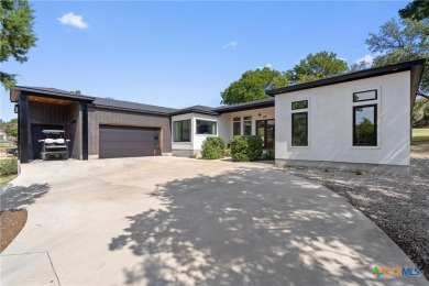 Stunning, modern-contemporary Point Venture home nestled just on Point Venture Golf Club on Lake Travis in Texas - for sale on GolfHomes.com, golf home, golf lot