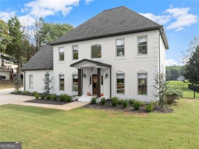 Absolutely stunning two-story home situated on the 6th fairway on Royal Lakes Golf and Country Club in Georgia - for sale on GolfHomes.com, golf home, golf lot