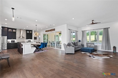 Stunning, modern-contemporary Point Venture home nestled just on Point Venture Golf Club on Lake Travis in Texas - for sale on GolfHomes.com, golf home, golf lot