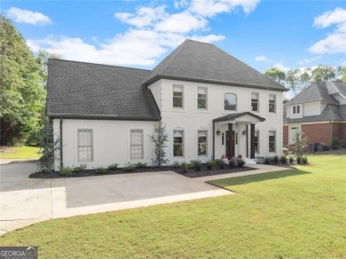 Absolutely stunning two-story home situated on the 6th fairway on Royal Lakes Golf and Country Club in Georgia - for sale on GolfHomes.com, golf home, golf lot