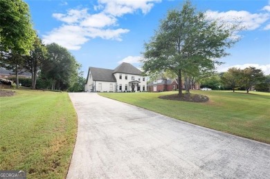 Absolutely stunning two-story home situated on the 6th fairway on Royal Lakes Golf and Country Club in Georgia - for sale on GolfHomes.com, golf home, golf lot