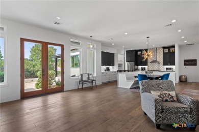 Stunning, modern-contemporary Point Venture home nestled just on Point Venture Golf Club on Lake Travis in Texas - for sale on GolfHomes.com, golf home, golf lot