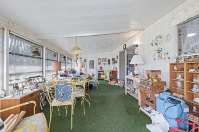 This 2 bedroom, 2 bath home with a covered carport wraps you in on High Point Golf Club, Inc. in Florida - for sale on GolfHomes.com, golf home, golf lot