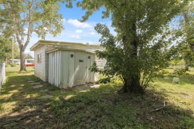 This 2 bedroom, 2 bath home with a covered carport wraps you in on High Point Golf Club, Inc. in Florida - for sale on GolfHomes.com, golf home, golf lot