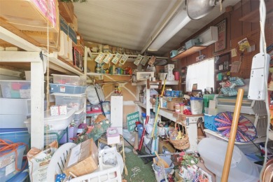 This 2 bedroom, 2 bath home with a covered carport wraps you in on High Point Golf Club, Inc. in Florida - for sale on GolfHomes.com, golf home, golf lot