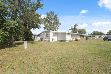 This 2 bedroom, 2 bath home with a covered carport wraps you in on High Point Golf Club, Inc. in Florida - for sale on GolfHomes.com, golf home, golf lot