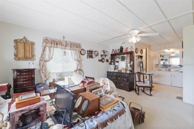 This 2 bedroom, 2 bath home with a covered carport wraps you in on High Point Golf Club, Inc. in Florida - for sale on GolfHomes.com, golf home, golf lot