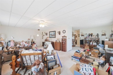 This 2 bedroom, 2 bath home with a covered carport wraps you in on High Point Golf Club, Inc. in Florida - for sale on GolfHomes.com, golf home, golf lot