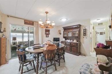 This 2 bedroom, 2 bath home with a covered carport wraps you in on High Point Golf Club, Inc. in Florida - for sale on GolfHomes.com, golf home, golf lot