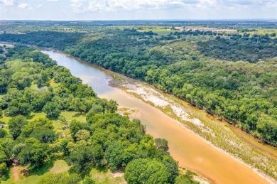 ENCHANTING 3-3-2 home nestled on a beautiful 1+ acre riverfront on Pecan Plantation Country Club in Texas - for sale on GolfHomes.com, golf home, golf lot