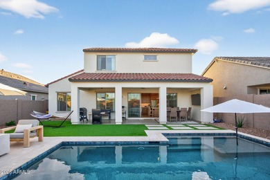Pool home with a spa & panoramic views of the White Tank on Verrado Golf Club  in Arizona - for sale on GolfHomes.com, golf home, golf lot